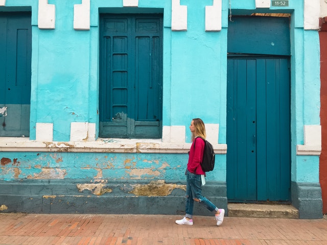 woman walking outside to represent busy going from responsibility to responsibility