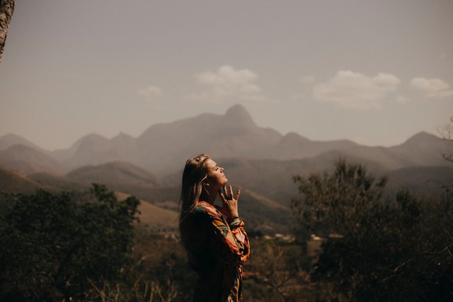 girl outside looking to God